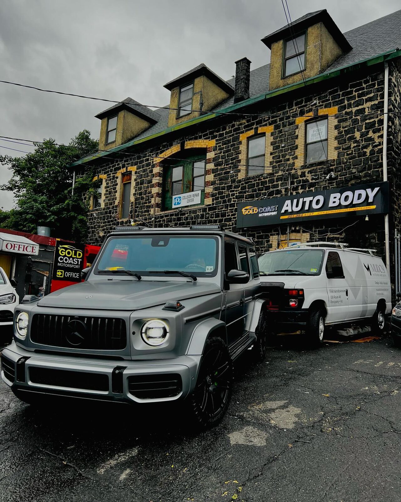 Matte grey Mercedes-AMG G63 parked at the Gold Coast Motorsport shop entrance.